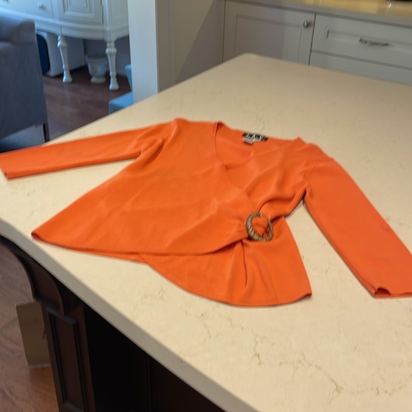 Beautiful wrap top in a striking tangerine color. - Picture 5 of 7